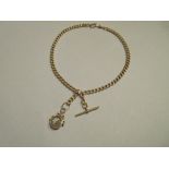 An 18ct gold double watch chain with a compass swivel fob, the curb link chains joined - to be