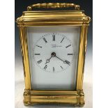 A 19th century French gorge case carriage clock, the gilt case with rectangular enamel dial