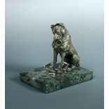 A 19th century polished bronze hound inkwell, he sits with his front paws on a huntsman's whip, a