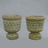 A pair of mid-17th century Bath stone small garden vases, each decorated with a fluted frieze (2) 43