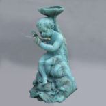 A bronze fountain of a Cherub seated on a Dolphin playing a flute, with stylised lily pad bowl,