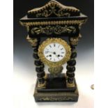 A French 19th century portico clock, the typical gilt metal mounted case with four spiral turned