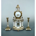 A French 19th century gilt metal mounted clock garniture, the demi-lune white marble case on four