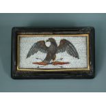 An early 19th century eagle micromosaic within a tortoiseshell lid, the bird with spread wings