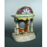 A Staffordshire pottery pocket watch stand, possibly Obadiah Sherratt, circa 1810, modelled as a