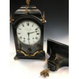 A French ebonised bracket clock, early 19th century, the break arch case with flame shape brass