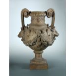 J Garouste, Castelnaudary', a French terracotta two handled urn, the baluster body with lion mask