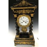 A French 19th century portico clock, the typical gilt metal mounted case with four spiral turned