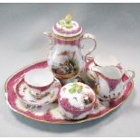 A Vienna porcelain cabaret set, each piece painted with Watteauesque vignettes of courting couples