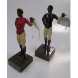 Two metal and enamelled models of jockeys, 26cm high