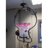 A Victorian brass handing gas lamp with pink opalescence shade - converted for electricity