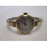 An 18ct ladies wristwatch on a rolled gold expanding bracelet