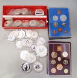 Approximately forty silver 1oz coins, together with an eight dollar 5oz coin, and four 2oz silver