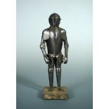 A late 19th century miniature part-articulated suit of armour, standing on a plinth, 30cm (12in)