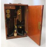 A Pickard & Curry mahogany cased brass microscope