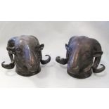 Two bronze ram's heads 15cm (6in)