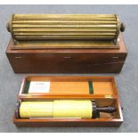 An early 20th century Thatcher's calculator, cased, 61cm (24in) the case, together with another