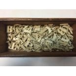 A box of approximately one hundred and eighty-three 19th century carved bone letters, possibly