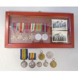 A cased set of WWII medals awarded to Harry Pitt; and other loose WWI medals