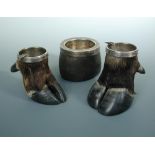 Two hooves with plated mounts as ashtrays and another leather bowl with plated mount (3)