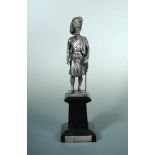 A silvered model of a Scots Guard on plinth, standing in full dress uniform, maker Wilson Sharp Ltd,