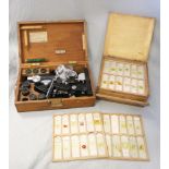 A mid 20th century C Baker London microscope, boxed, together with a case of slides