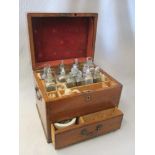 A Victorian oak Apothecary cabinet, fitted with glass medicine jars and drawer to base, side