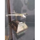 A presentation silver plated model of a jet fighter, on wood stand with presentation plaque, '