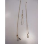 A sapphire and diamond pendant and chain, an opal pendant and chain and a chain bracelet set with