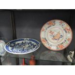 A Chinese blue and white dish (small rim chip) 36cm diameter, and another dish 32cm, unmarked (2)