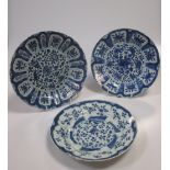 A Kangxi blue and white plate the rim with lappet panels of flower stems on a cracked ice ground and