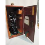 A J Swift & Sons microscope with black painted body, contained in a teak case, 41 cm (16in) high