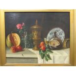 E* FOURNIER (late 19th/early 20th century), Still life of wine, fruits, a single rose held in a
