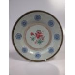A mid 18th century Chinese famille rose plate with eight overglaze blue roundels enclosing a peony