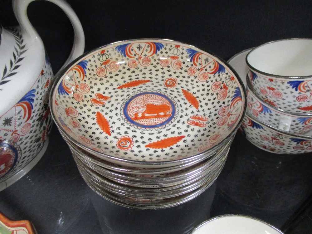 An early 19th century part teaset with naieve 'lion' motif decoration within panels, with 10 cups - Image 3 of 3