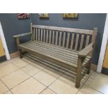 A teak garden bench in the manner of Barlow Tyrie 191cm wide