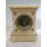 An alabaster case mantel clock with visible movement, 27 x 19cm