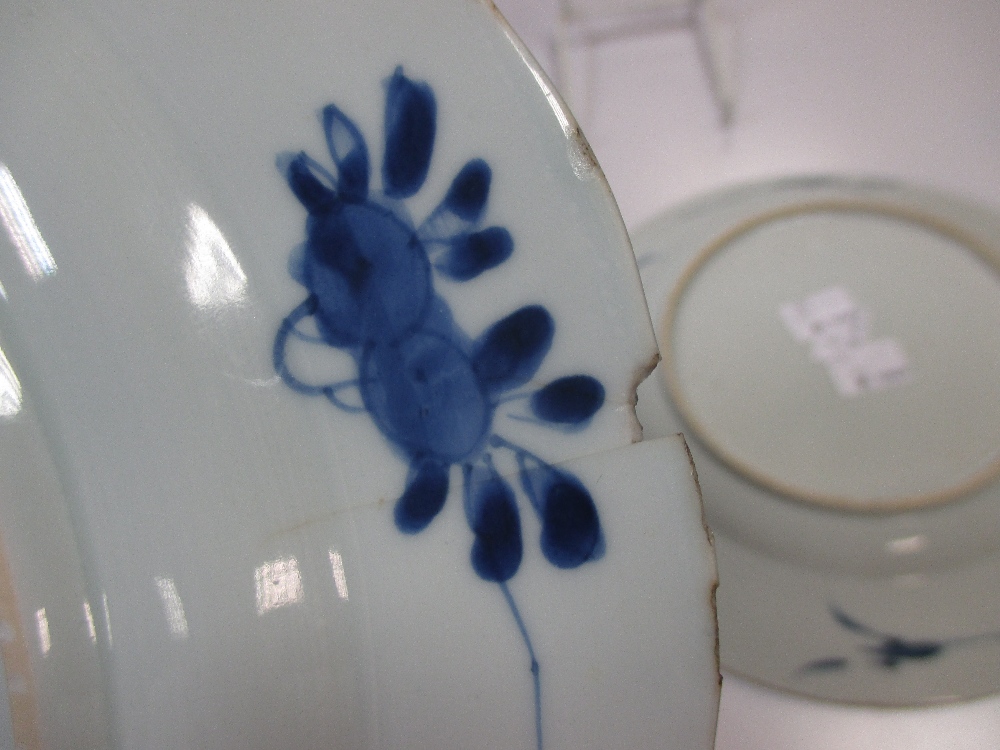 A Kangxi blue and white plate the rim with lappet panels of flower stems on a cracked ice ground and - Image 5 of 5