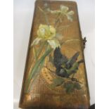 A late 19th century floral painted leather album, mainly including family portraits, and a few