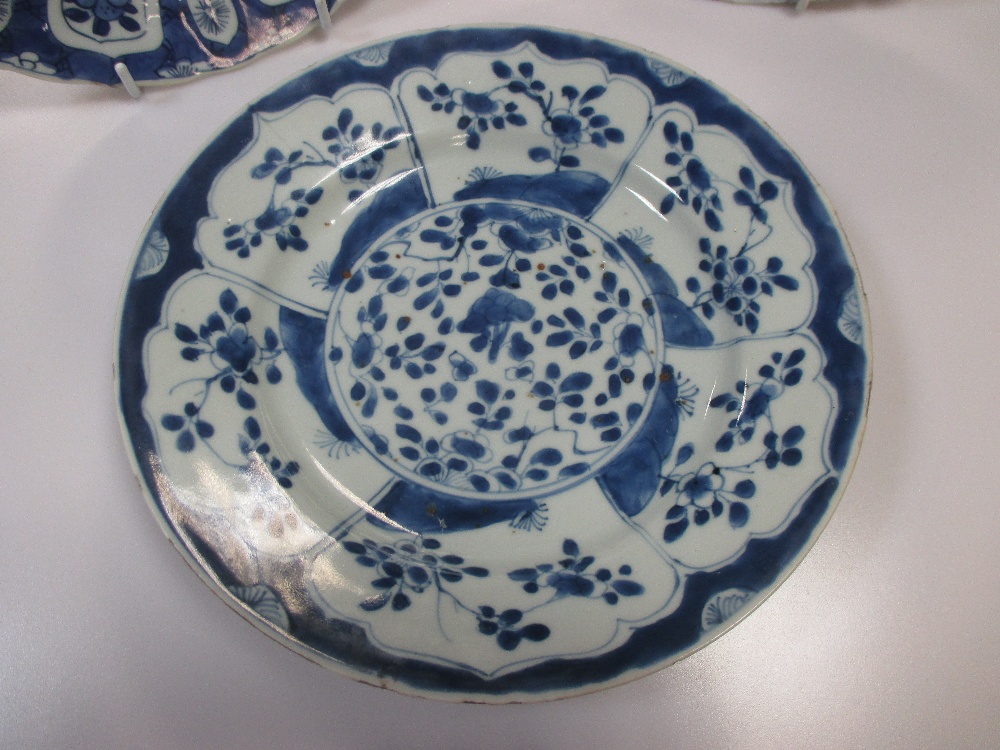 A Kangxi blue and white plate the rim with lappet panels of flower stems on a cracked ice ground and - Image 2 of 5