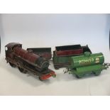 Model trains including a Bing loco and tender, Hornby Series wagons, clockwork loco, etc. all in