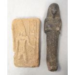 An Egyptian red clay rectangular tablet, moulded with a standing priest, 13cm (5in) high, together