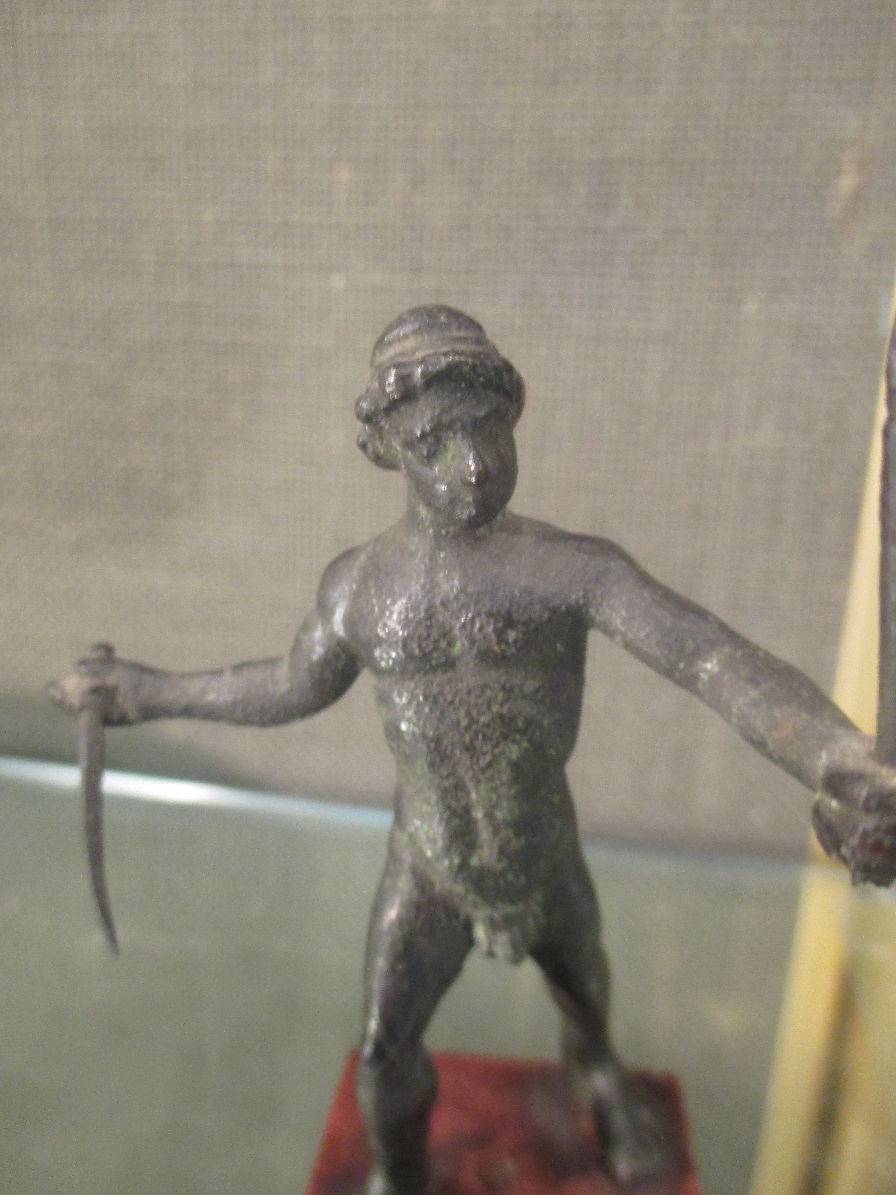 A small bronze after the Antique of a standing man holding swords - Image 6 of 6