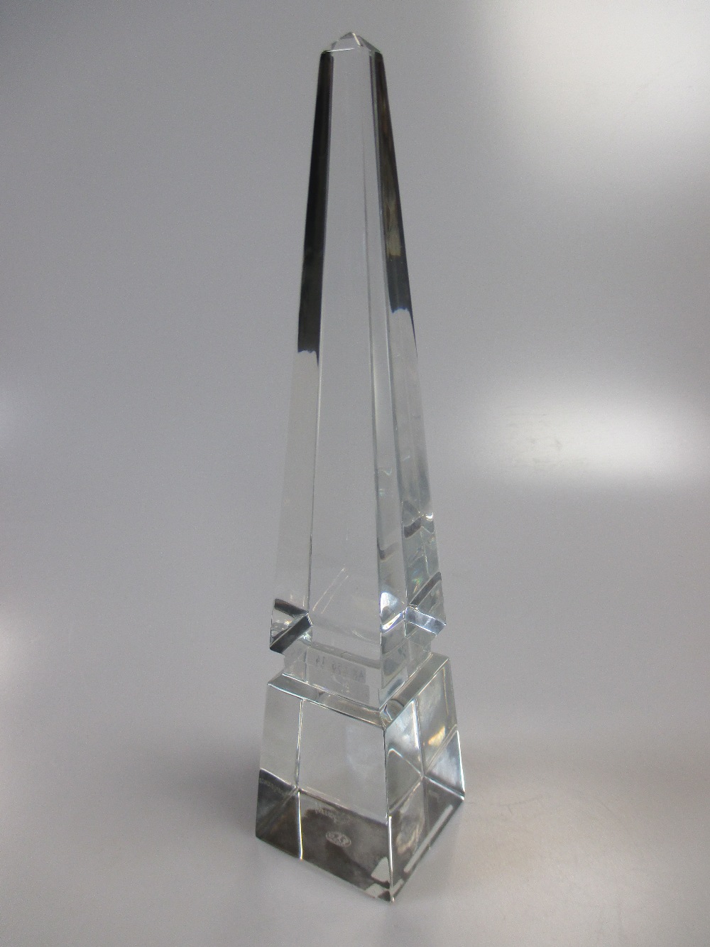 A glass obelisk by Baccarat in the original case 25cm high
