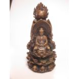 A Tibetan bronze cast with three enthroned Buddhas 23.5cm high