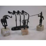 A miniature bronze model after Giacometti, together with a collection of other miniature bronze