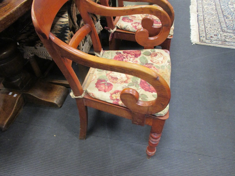 A pair of 19th century elm panel seat elbow dining chairs on turned legs (2) - Image 3 of 3