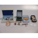 A collection of silver and gold jewellery to include three gold rings, four brooches, two