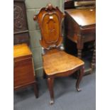 A Victorian oak hall chair