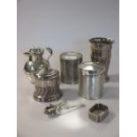 A collection of silver items including three cigarette boxes, a lidded jug, some spoons, a napkin